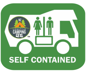 White silhouette of a camper against a green background. Inside are the male/female icons usualy found on public toilets and an NZ Lifetyle Camping logo. The words 